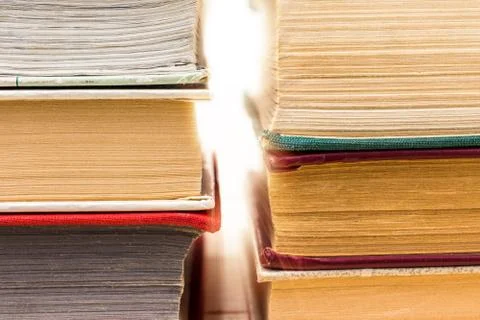 Stack of books, concept light of knowledge Stock Photos