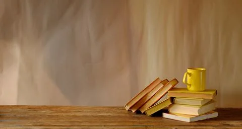 Stack of books, cup of coffee, panorama, good copy space Stock Photos