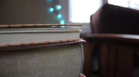 Stack of books in a decorated home for Christmas Stock Footage 44447925