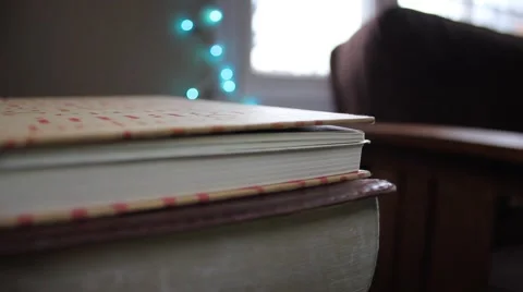 Stack of books in a decorated home for Christmas Stock Footage 44447956