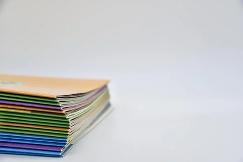 A stack of books with different colored covers Stock Photos