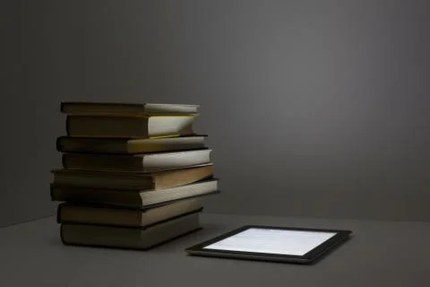 Stack of books with digital tablet Stock Photos