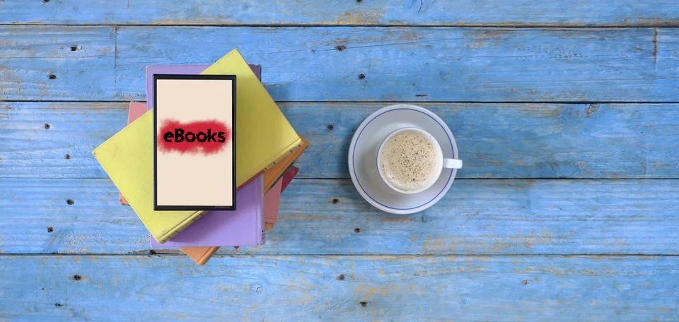 Stack of books, eBook reader and cup of cappuccino coffee, flat lay,copy space Stock Photos