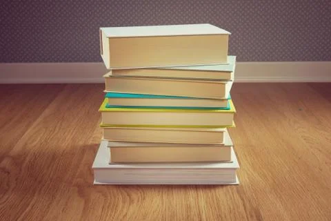 Stack of books on the floor Stock Photos