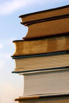 Stack of books in front of sky Stock Photos