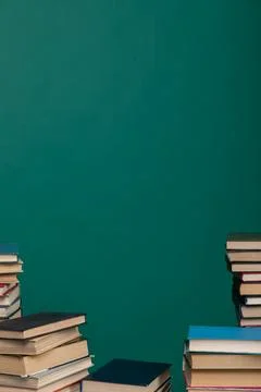Stack of books on a green background learning library learning science Stock Photos