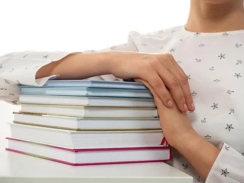 Stack of books with hands on it Stock Photos