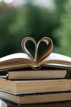 Stack of books with heart shape Stock Photos