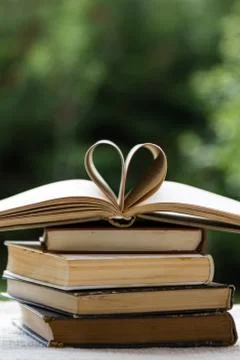 Stack of books with heart shape Stock Photos