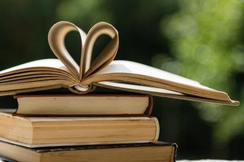 Stack of books with heart shape Stock Photos