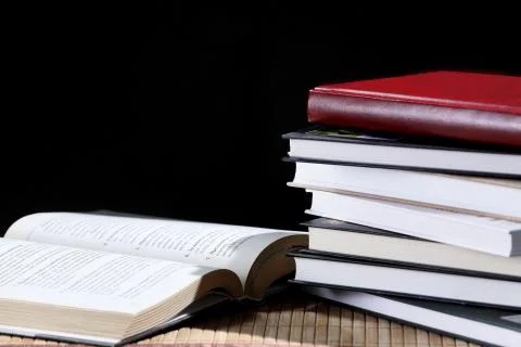 Stack of books isolated on a black background Stock Photos
