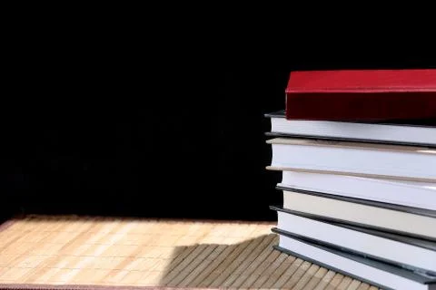 Stack of books isolated on a black background Stock Photos