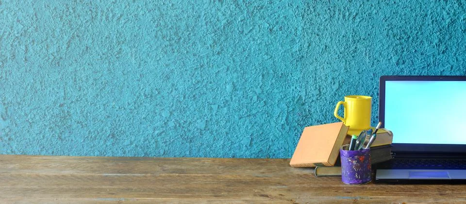 Stack of books laptop computer and office supplies,home office, homeschooling Stock Photos