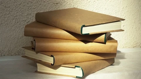 A stack of books lies on the table in the library Video stock 156229601