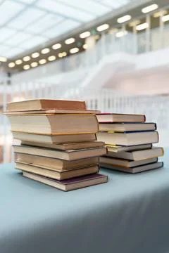 A stack of books lying on the table. Stock Photos