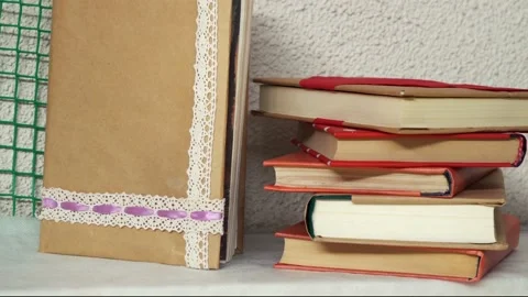 Stack of books lying on top of each other in the library Stockbeeldmateriaal 168897667