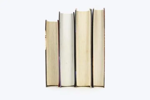 A stack of books lying on a white background Stock Photos