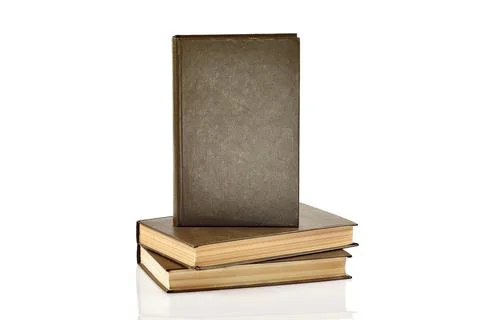 Stack of Books with One Standing Cover Facing Forward Isolated on White Stock Photos