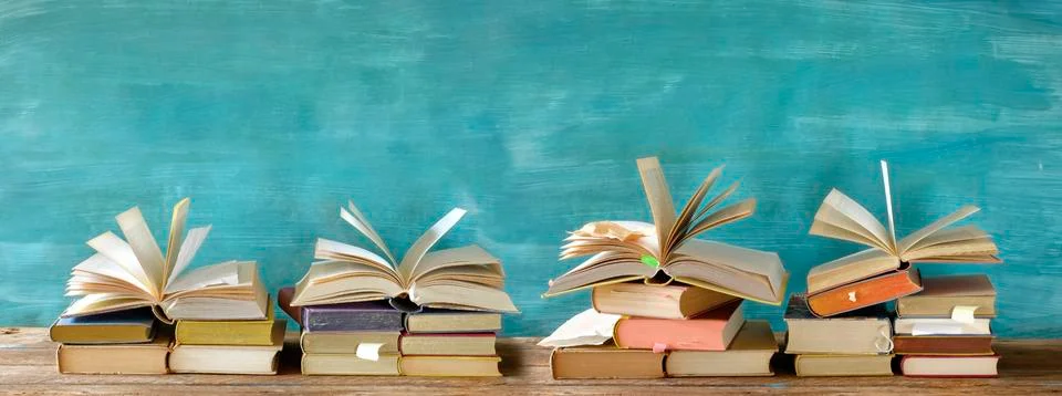 Stack of books with open books in a row. Reading,literature,education,library Stock Photos
