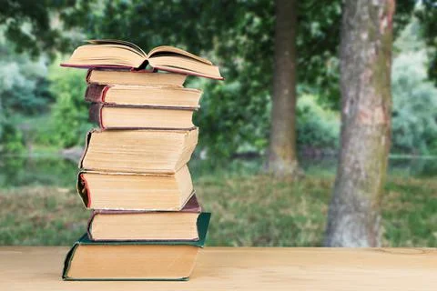 Stack of books over the natural background Stock Photos