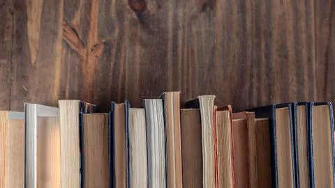 Stack of books over wooden table. Library, Read. Edication. Literature. Stock Photos