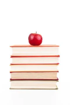 Stack of books with red apple Stock-Fotos