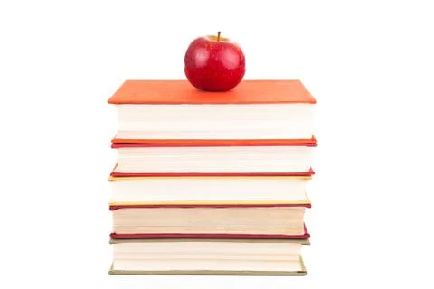 Stack of books with red apple Foto stock