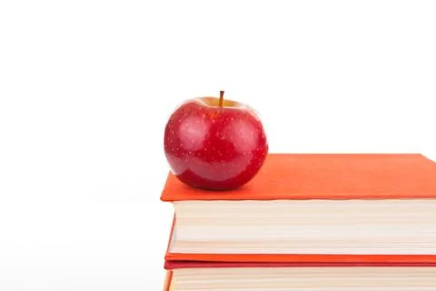 Stack of books with red apple Stock Photos