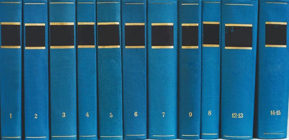 Stack of books on the shelf, blank spines Stock Photos