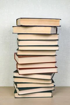 A stack of books on a shelf in a library. Concept reading, education Stock Photos