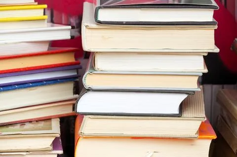 Stack of books on the shelf in the library. Education concept. Stock Photos