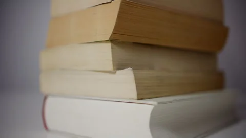 Stack of books with slow left to right camera movement Stock Footage 327376167