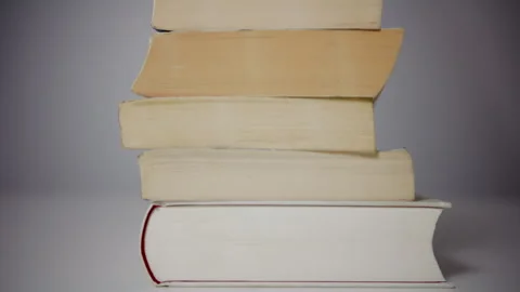 Stack of books with slow left to right camera movement Stock Footage 327376174