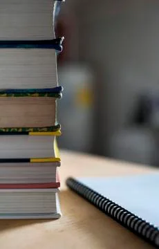 Stack of books with spiral notebook Fotos de archivo