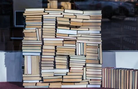 Stack of books is stacked in chaotic manner Stock Photos