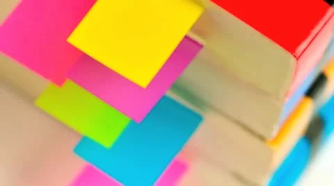 Stack of books with tab organizers Видео 21303646