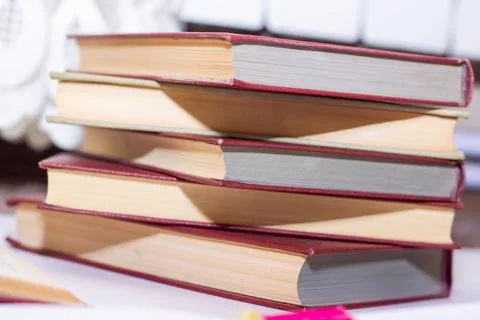 Stack of books on the table, pile of books, book background Photos