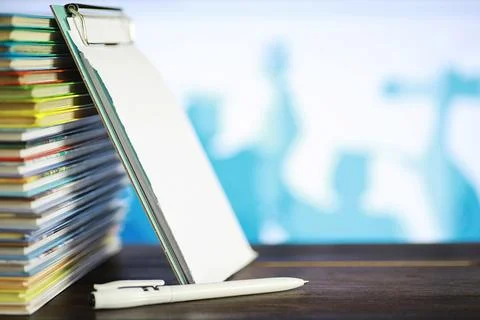 A stack of books. Textbooks on the table. Tutorials are on the desk. Stock Photos