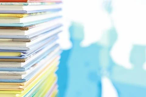 A stack of books. Textbooks on the table. Tutorials are on the desk. Stock Photos