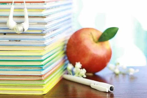 A stack of books. Textbooks on the table. Tutorials are on the desk. Stock Photos