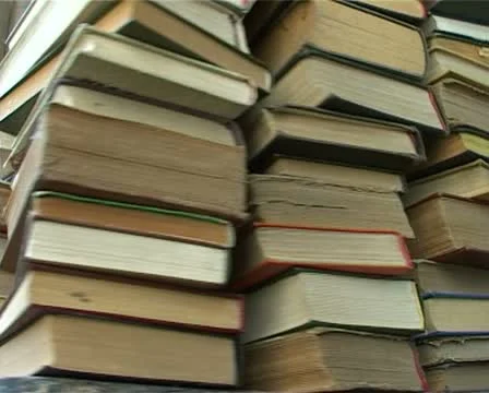 Stack of books turns Stock Footage 11352496
