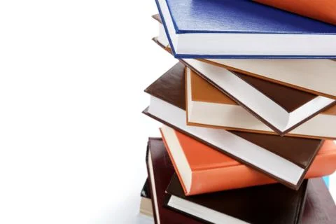 A stack of books on a white background. Stock Photos