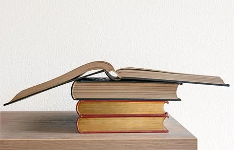 A stack of books on the white background.. Stock Photos