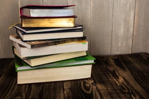 Stack of books on wooden background Stock Photos