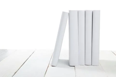 Stack of books at wooden shelf isolated on white background. Back to school Stock Photos