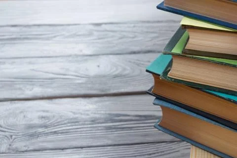Stack of books on wooden table. Back to school. Copy space Stock Photos