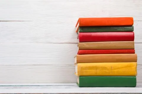 Stack of books on wooden table. Back to school. Copy space Stock Photos