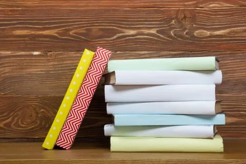 Stack of books on wooden table. Back to school. Copy space Stock Photos