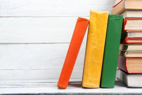 Stack of books on wooden table. Back to school. Copy space Photos