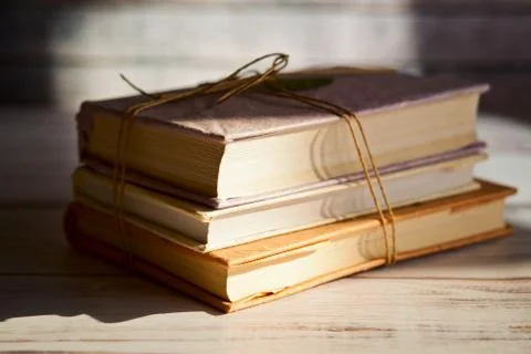 Stack of books on a wooden table Stock Photos